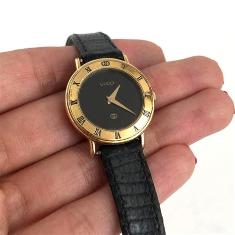 gucci watch black and gold